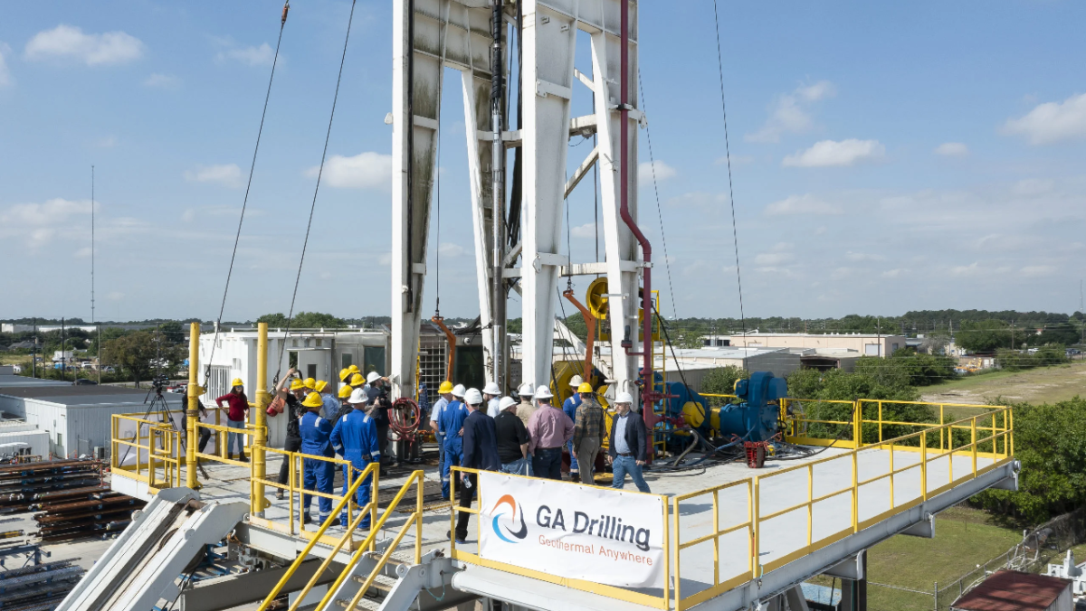 GA Drilling crew gathered around geothermal drilling equipment during field testing