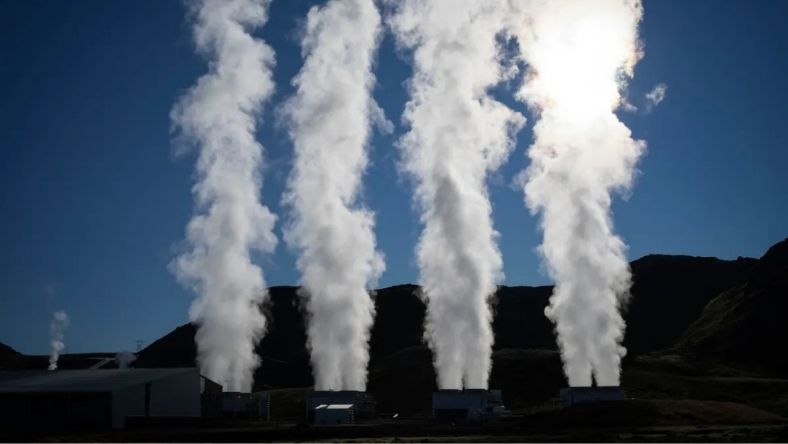 Steam rising from geothermal power plant cooling towers